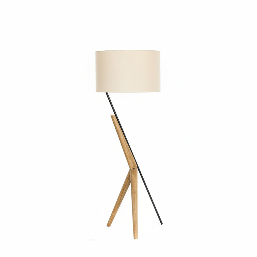 Floor lamp with a wooden base and white shade on a white background