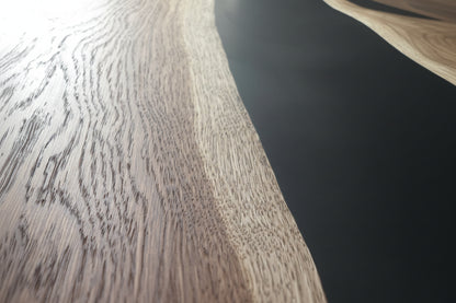 STRØM river coffee table with dark epoxy resin and live edge oak on black steel legs close-up